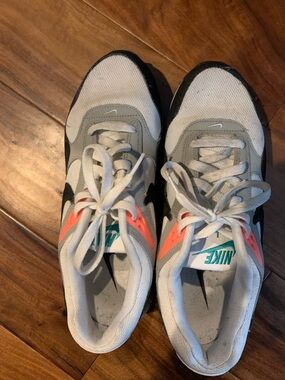 Nike women’s White, Gray & Black Sneakers with Coral Highlights